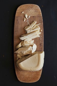 Overhead view of cocoa butter on wooden board