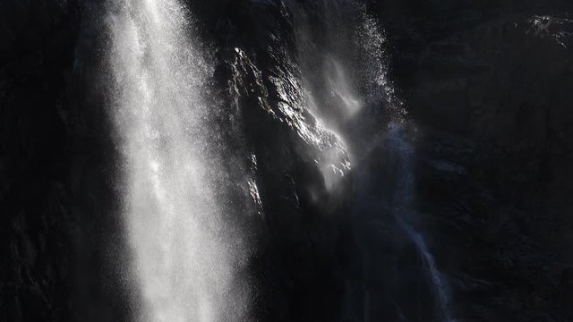 Beautiful slow motion detail of Gavarnie Falls at Cirque de Gavarnie, Pyrenees, France. Sunlit water.
