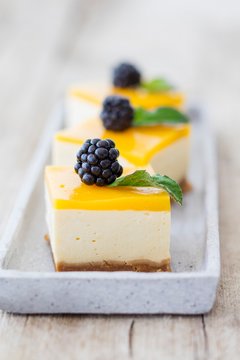 Mango mousse cake with blackberries