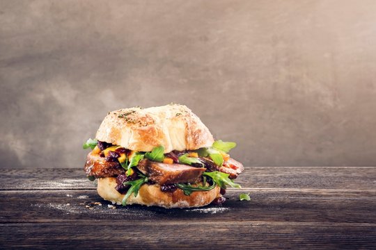 A roll with goose breast, rocket and mango chutney