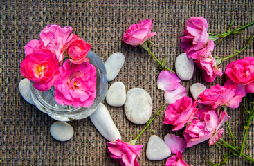Pink rose bouquet on wooden rustic background