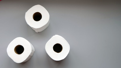 Flat lay of three toilet paper rolls