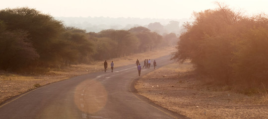 People walking at the side of the road © michaklootwijk