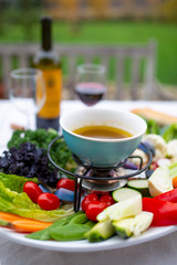 Traditional Italian dish - Bagna cauda. Hot sauce and raw vegetables. 