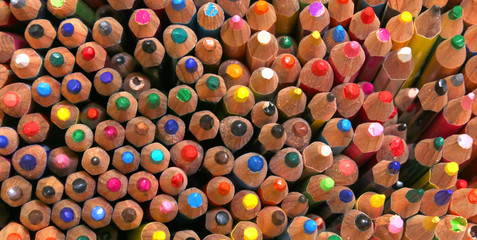 Fototapeta na wymiar background of colorful wooden crayons of various colors