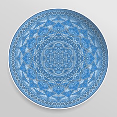 Decorative plate with round ornament in ethnic style. Vector mandala.