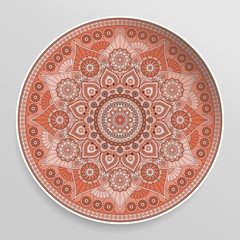 Decorative plate with mandala in red colors. Vector ornament.