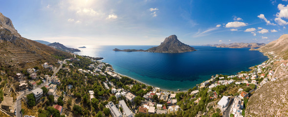 Panoramic landscape of Telendos island in distance and part of Kalymnos island, Massouri, Greece