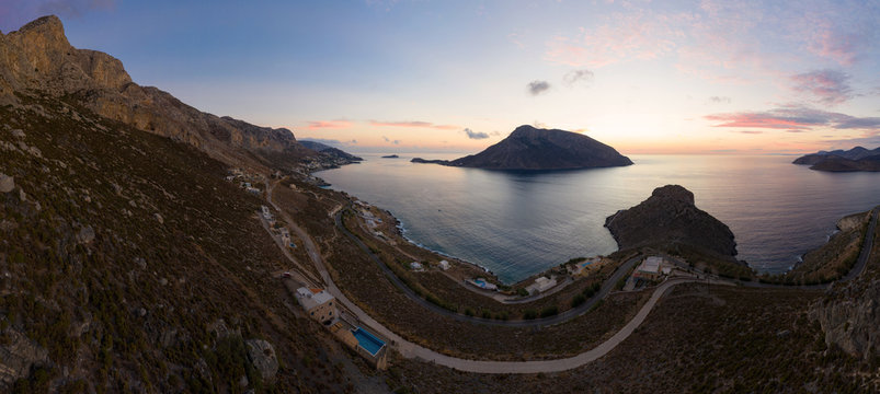 Panoramic landscape of Telendos island in distance and part of Kalymnos island at sunset, Greece
