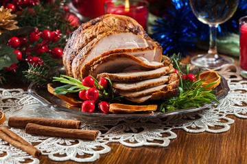 Roasted pork ham served with baked potatoes