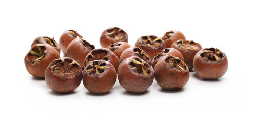 Fresh medlars isolated on white background