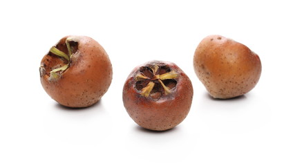 Fresh medlars isolated on white background