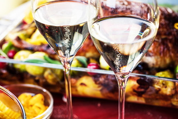 Christmas themed dinner table with champagne glass