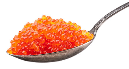 Spoon full of red caviar on white background. Macro picture. Clipping path.