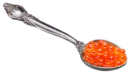 Spoon full of red caviar on white background. Macro picture. Clipping path.
