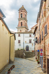 Fototapeta na wymiar View at the Bell tower of church of Saint Michael Archangel in Lucignano - Tuscany,Italy