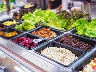 Salad bar buffet are available for sale in the food supermarket which there are many fresh vegetable, fruit and cereal grain in the tray for customer to buy back to eat at home, Healthy diet