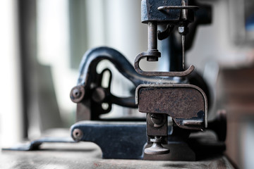 Ancient sewing machine Placed in an old-fashioned house in Thailand.soft focus.