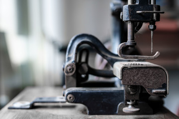 Ancient sewing machine Placed in an old-fashioned house in Thailand.soft focus.