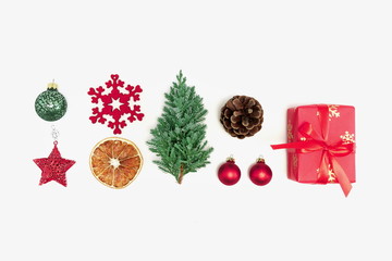 Christmas trendy composition. Xmas red and green decorations on white background. Christmas, New Year, winter concept. Flat lay, top view, copy space 