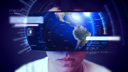 Young man wearing VR headset and experiencing virtual reality. Technology related digital earth network concept.