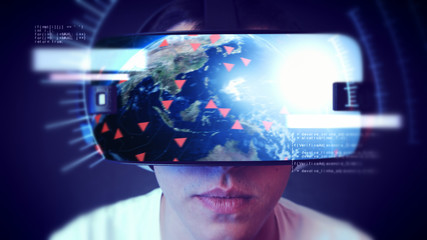 Young man wearing VR headset and experiencing virtual reality. Technology related digital earth network concept.
