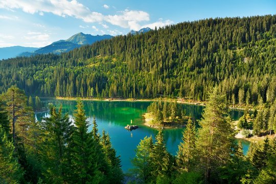 Lake Cauma with island, bathing lake in the Flims large forest, Flims, canton Graubunden, Switzerland, Europe