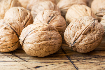 Walnuts on dark vintage wooden background. Walnut healthy food
