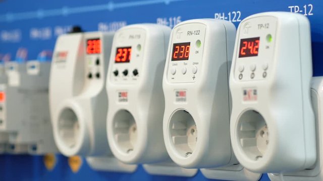 Smart plugs with voltage sensor for ordinary outlet plug at the exhibition. Close up