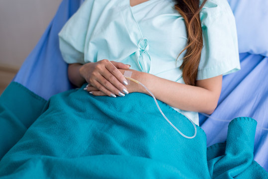 Hand patient woman receiving with saline solution and treatment