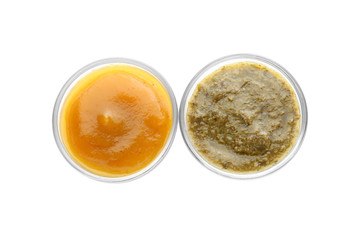 Tasty sauces in bowls on white background