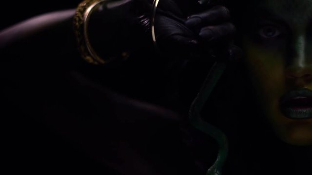 Gorgon Medusa hypnotizing with her hands