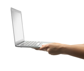 Female hands holding laptop on white background