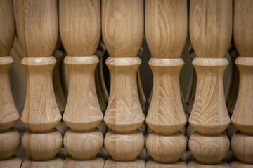 Elements of wooden stairs. Oak balusters. Production of wooden stairs.