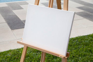 Blank white artistic canvas outdoors close up view