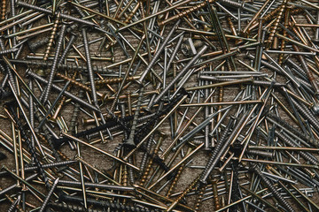 Top view of nails tools on dark wooden table