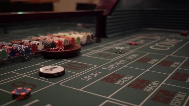 Dice being tossed on a craps table