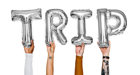 Hands showing trip balloons word