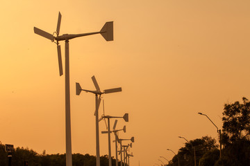 Obraz premium Wind turbines at sunset.