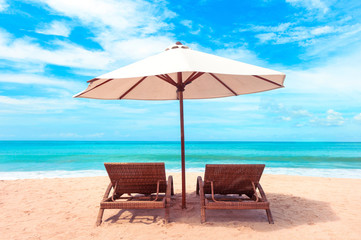 Beautiful beach. Chairs on the  sandy beach near the sea. Summer holiday and vacation concept.