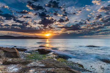 Fototapeta premium Sunrise Seascape with Clouds
