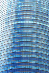 Glass blue square Windows of facade modern city business building skyscraper. Modern apartment buildings in new neighborhood. Windows of a building, texture.