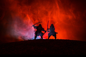 Silhouette of two samurais in duel. Picture with two samurais and sunset sky © zef art