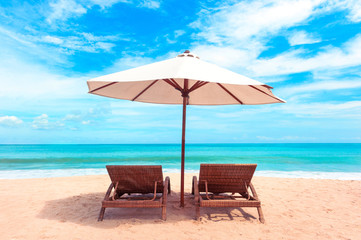 Chairs on the beach near sea. Beautiful tropical white beach. Holiday and vacation concept.
