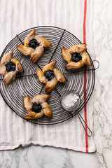 Scandinavian pastry Joulutorttu is traditional finnish and Swedish christmas pastry. It is traditionally made from puff pastry in the shape of a star or pinwheel and filled with prune jam and often du