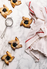 Scandinavian pastry Joulutorttu is traditional finnish and Swedish christmas pastry. It is traditionally made from puff pastry in the shape of a star or pinwheel and filled with prune jam and often du