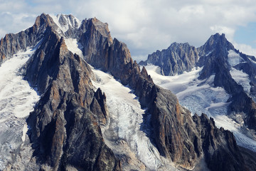 Petit Dru and a white cloud similar to a chimney and smoke, Chamonix, France