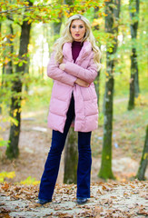 How to rock puffer jacket like star. Fall fashion concept. Outfit prove puffer coat can look stylish. Jackets everyone should have. Girl fashionable blonde walk in park. Best puffer coats to buy