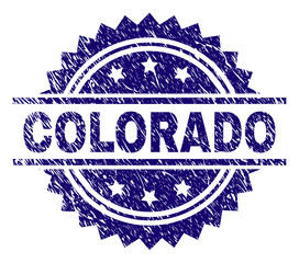 COLORADO stamp seal watermark with distress style. Blue vector rubber print of COLORADO text with dirty texture.