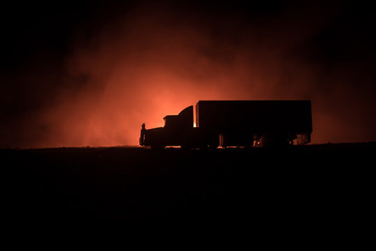 Big Truck Wagon Rides On The Road Outside The City At Night With Foggy Background. Decoration